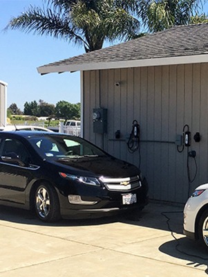 Two Chevy Volts charging with LCS-20, 16-Amp charging stations