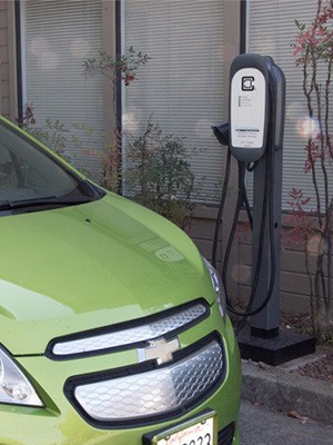 Chevy Spark charging with ClipperCreek in parking lot