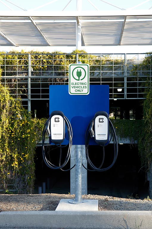 Commercial Electric Car Charging Stations Mounted to Outdoor Parking Lot University Campus